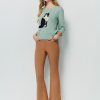 Flared pants with asymmetrical hem breasted